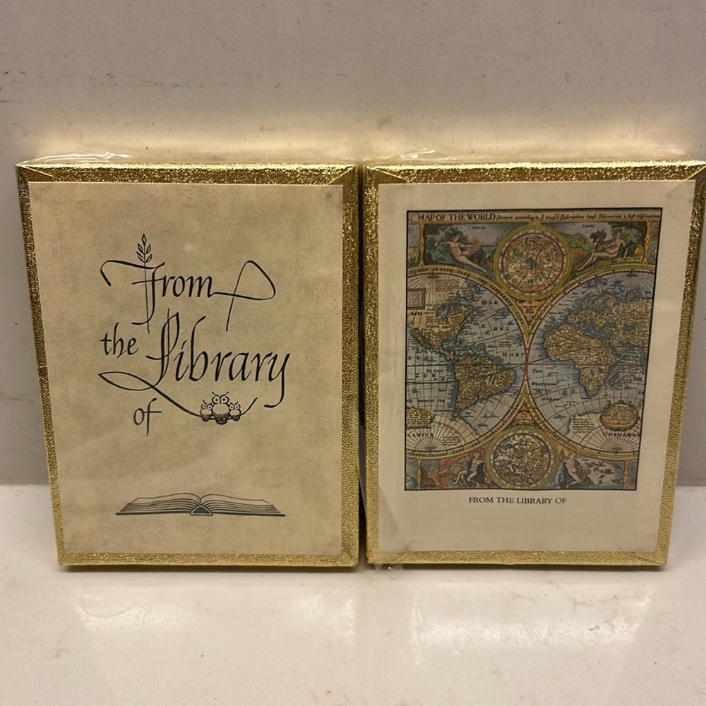 Two box sets of vintage Antioch bookplates classic script and world map.